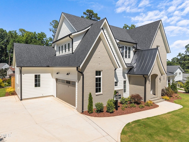 701 Dartmouth Rd, Raleigh, NC 27609 - view of front of house featuring concrete driveway, roof with shingles, brick siding, a garage, and a front lawn