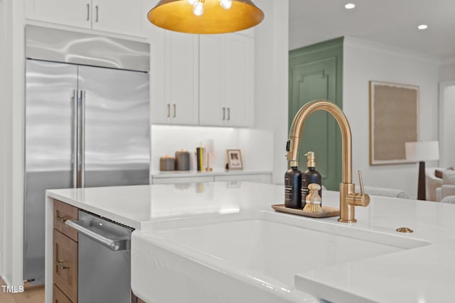 701 Dartmouth Rd, Raleigh, NC 27609 - kitchen with built in refrigerator, light countertops, recessed lighting, and white cabinets