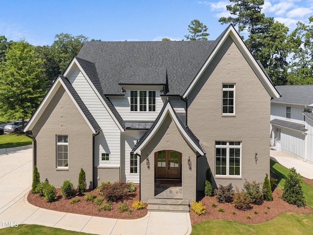 701 Dartmouth Rd, Raleigh, NC 27609 - view of front of property with brick siding and a standing seam roof
