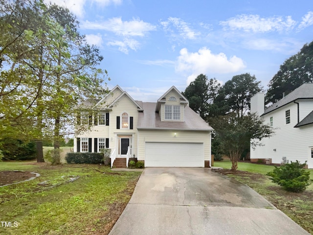 view of front facade with a garage and a front yard