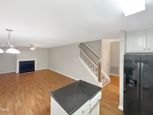 unfurnished living room featuring light wood-type flooring