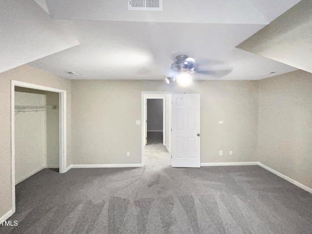 unfurnished bedroom featuring a closet, ceiling fan, and carpet floors