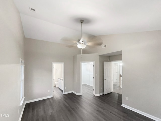 interior space featuring lofted ceiling, ceiling fan, and dark hardwood / wood-style flooring