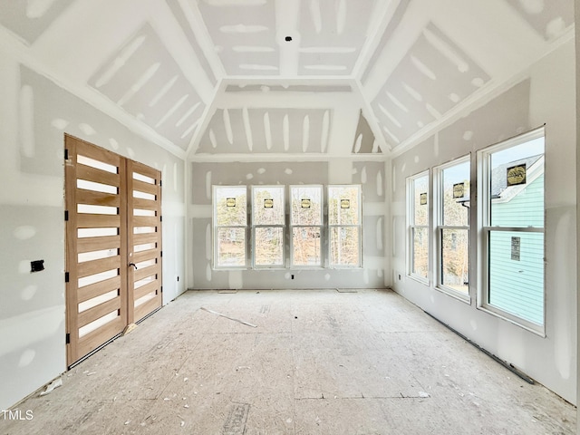 unfurnished sunroom with lofted ceiling