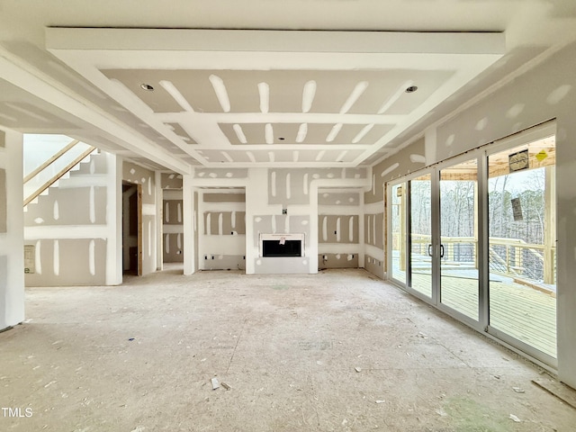 unfurnished living room featuring french doors