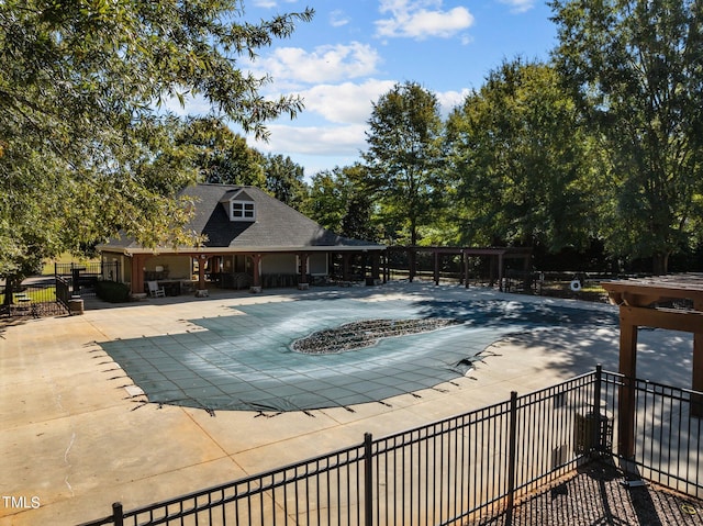 view of swimming pool with a patio area