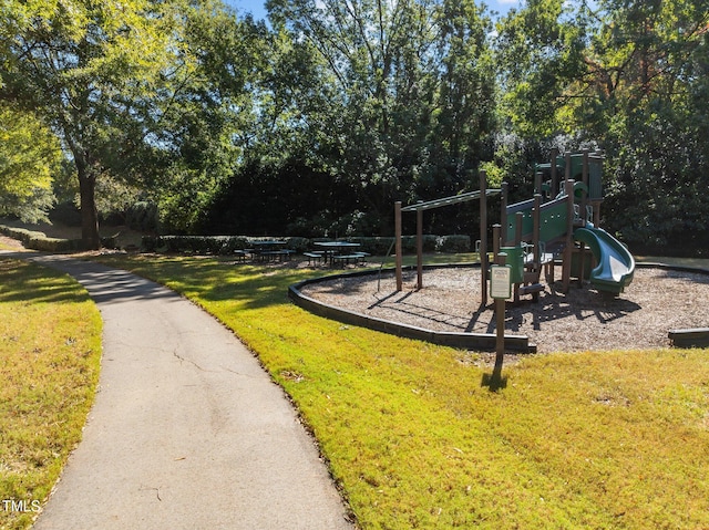 view of playground with a yard