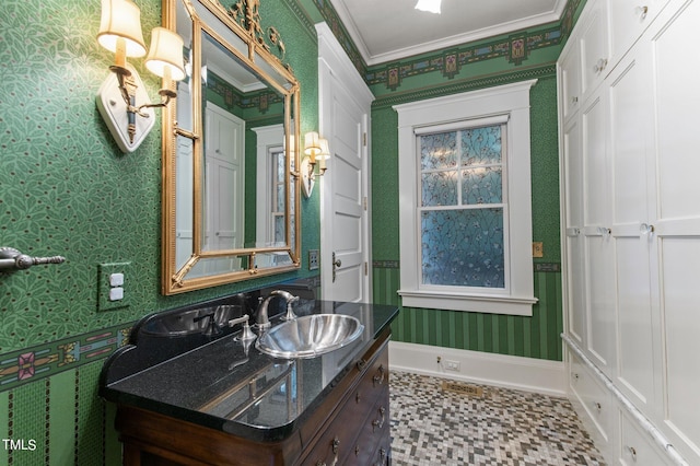 bathroom featuring vanity and ornamental molding