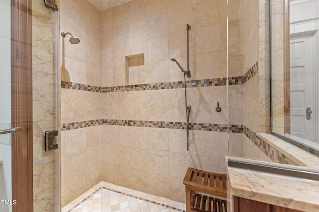 bathroom featuring a shower with door