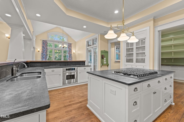 3105 Cone Manor Ln, Raleigh, NC 27613 - kitchen with stainless steel appliances, dark countertops, white cabinetry, crown molding, and a chandelier