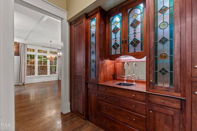 3105 Cone Manor Ln, Raleigh, NC 27613 - indoor wet bar with a chandelier and wood finished floors