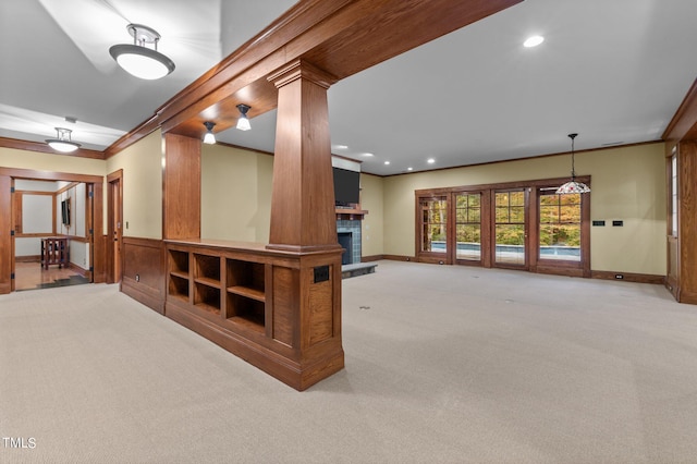 3105 Cone Manor Ln, Raleigh, NC 27613 - unfurnished living room with light carpet, a fireplace, ornamental molding, and recessed lighting