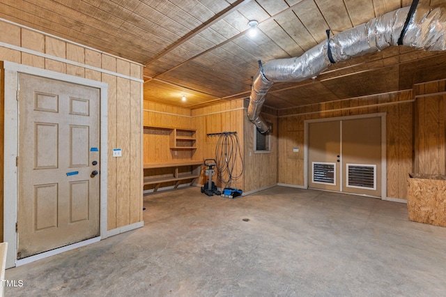 interior space featuring wood walls and wooden ceiling