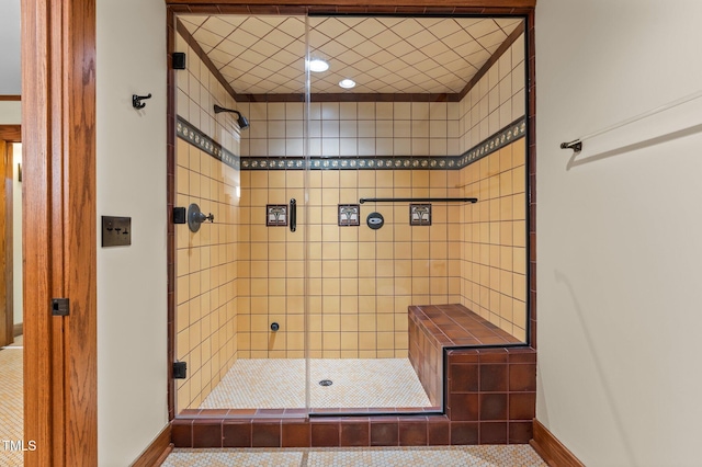 bathroom with tile patterned floors and an enclosed shower