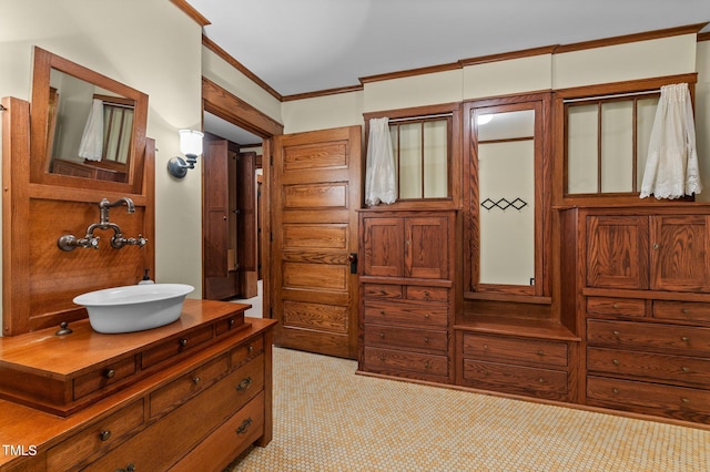 bathroom with vanity and ornamental molding