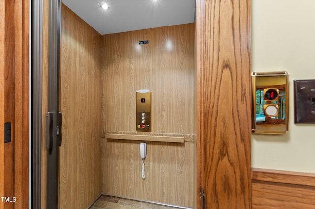 details with wood walls and elevator