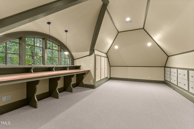 additional living space featuring light carpet and vaulted ceiling