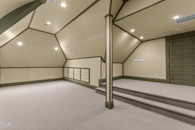 additional living space with carpet flooring and vaulted ceiling