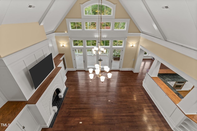 living room with beam ceiling, dark hardwood / wood-style floors, high vaulted ceiling, and a notable chandelier