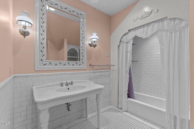 3105 Cone Manor Ln, Raleigh, NC 27613 - bathroom featuring tile walls, wainscoting, shower / tub combo, and tile patterned flooring