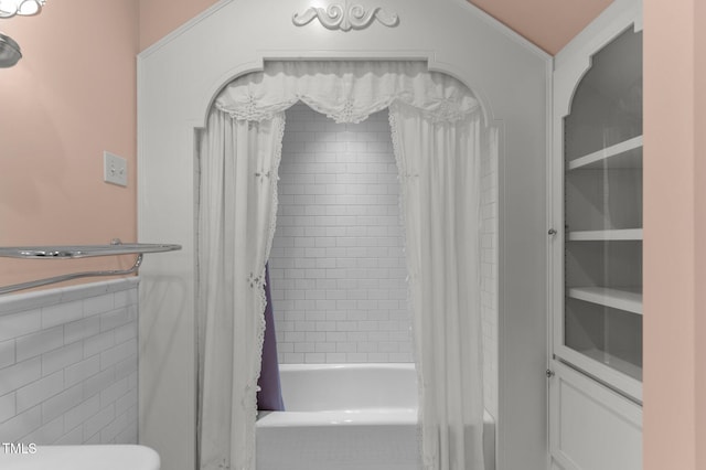 bathroom with shower / bathtub combination with curtain