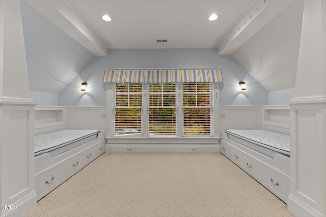 3105 Cone Manor Ln, Raleigh, NC 27613 - unfurnished bedroom with vaulted ceiling, carpet, wainscoting, and a decorative wall