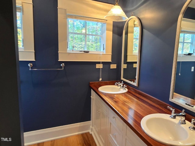 3105 Cone Manor Ln, Raleigh, NC 27613 - full bathroom featuring double vanity and baseboards