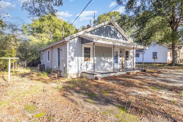 view of front of home featuring central AC unit and a porch