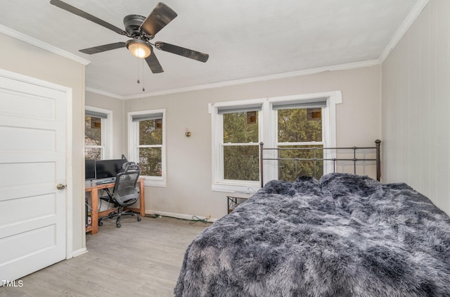 bedroom featuring light wood-type flooring, crown molding, and ceiling fan