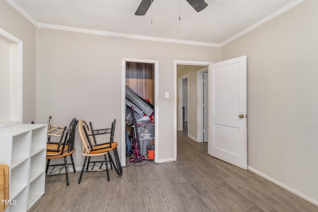 interior space featuring ceiling fan, crown molding, and light hardwood / wood-style floors