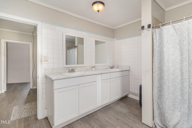 bathroom featuring tile walls, vanity, and hardwood / wood-style flooring