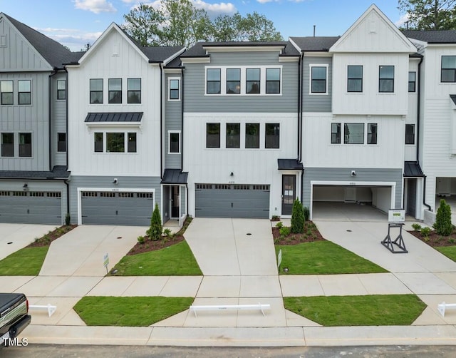 4505 Mint Leaf Ln, Raleigh, NC 27612 - view of property featuring a garage, a standing seam roof, and board and batten siding