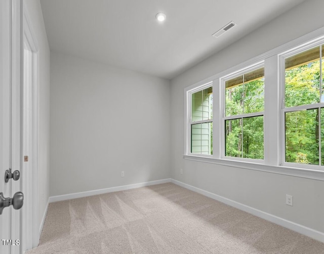 4505 Mint Leaf Ln, Raleigh, NC 27612 - empty room with plenty of natural light, baseboards, light colored carpet, and recessed lighting