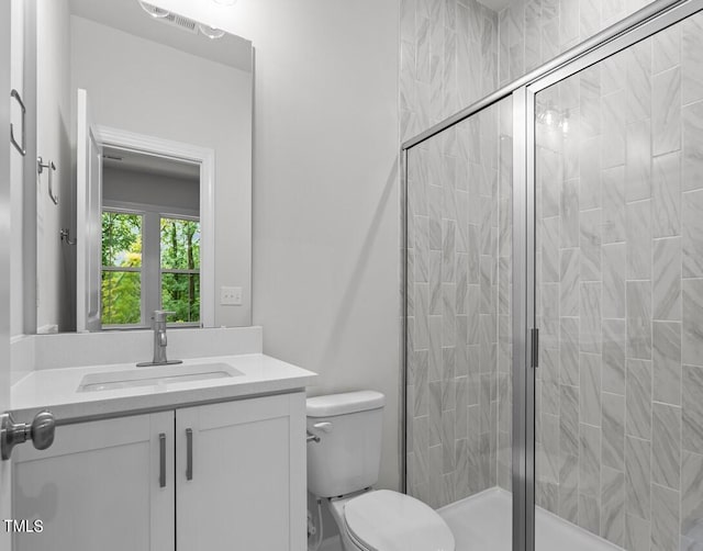 4505 Mint Leaf Ln, Raleigh, NC 27612 - bathroom with toilet, vanity, and a stall shower