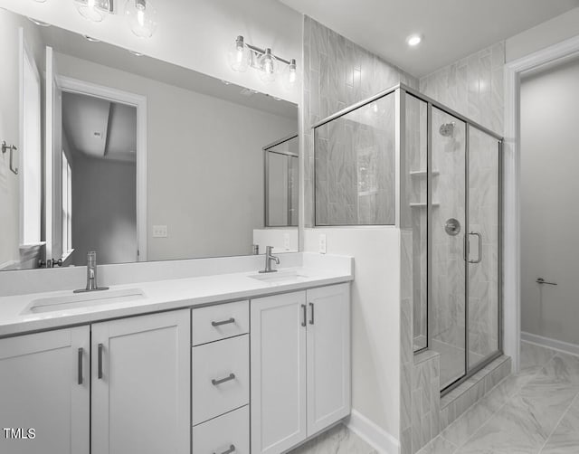 4505 Mint Leaf Ln, Raleigh, NC 27612 - full bath featuring marble finish floors, double vanity, a stall shower, baseboards, and recessed lighting