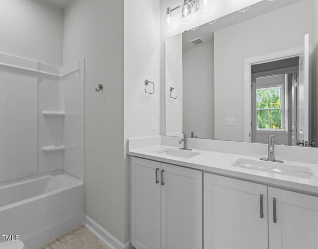 4505 Mint Leaf Ln, Raleigh, NC 27612 - full bath featuring double vanity, baseboards, tile patterned floors, and shower / bathtub combination