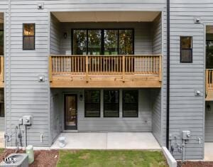 4505 Mint Leaf Ln, Raleigh, NC 27612 - rear view of house with a balcony and a patio