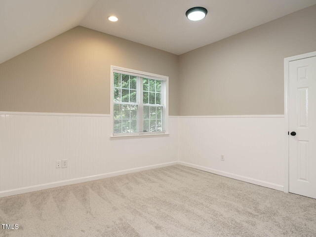 interior space featuring carpet and lofted ceiling