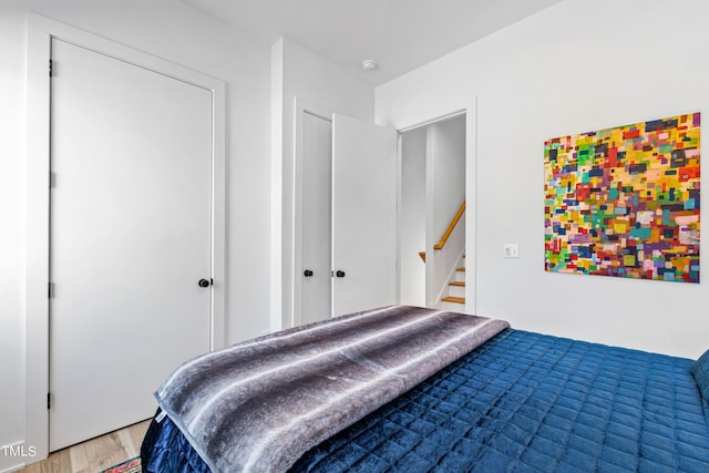 bedroom featuring light wood-style flooring