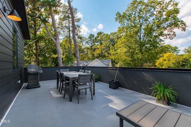 view of patio / terrace featuring outdoor dining area and a grill