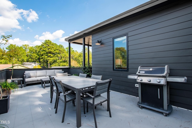 view of patio / terrace featuring an outdoor living space, outdoor dining area, and grilling area