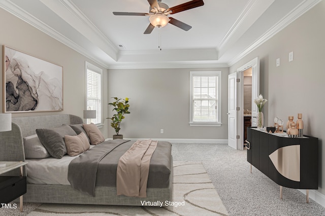 carpeted bedroom with ceiling fan, crown molding, and multiple windows