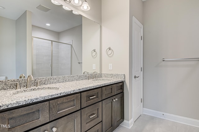 bathroom featuring vanity, toilet, and a shower with door