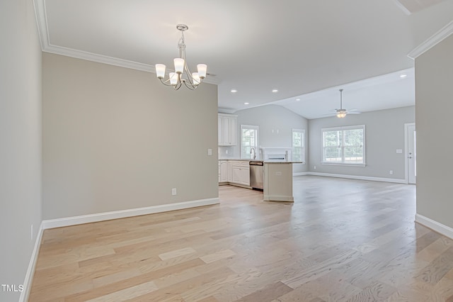 unfurnished living room featuring ceiling fan with notable chandelier, vaulted ceiling, light hardwood / wood-style floors, and crown molding