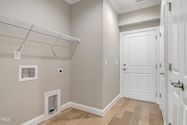 washroom with hookup for a washing machine, light wood-type flooring, and electric dryer hookup