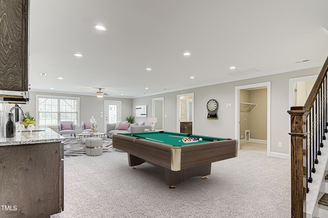 rec room featuring billiards, crown molding, ceiling fan, sink, and light carpet