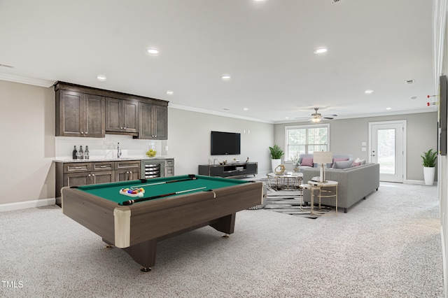 game room with indoor wet bar, ornamental molding, light carpet, and billiards