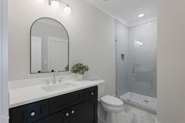 bathroom featuring a shower with door, vanity, and toilet