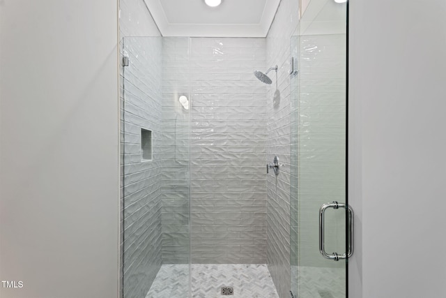 bathroom with a shower with shower door