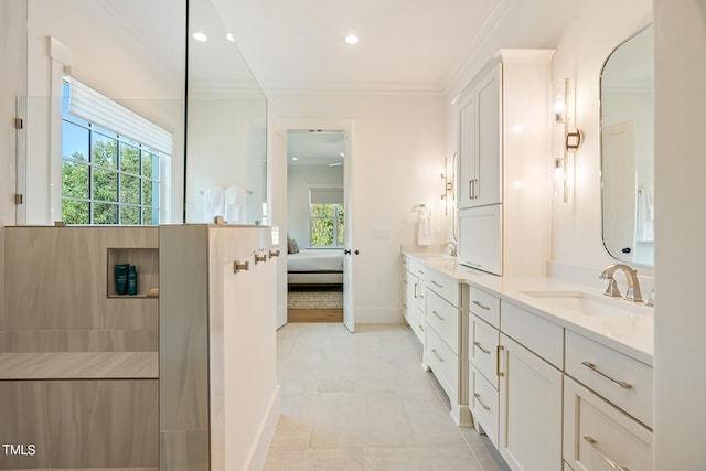 bathroom with vanity, crown molding, tile patterned flooring, and plenty of natural light